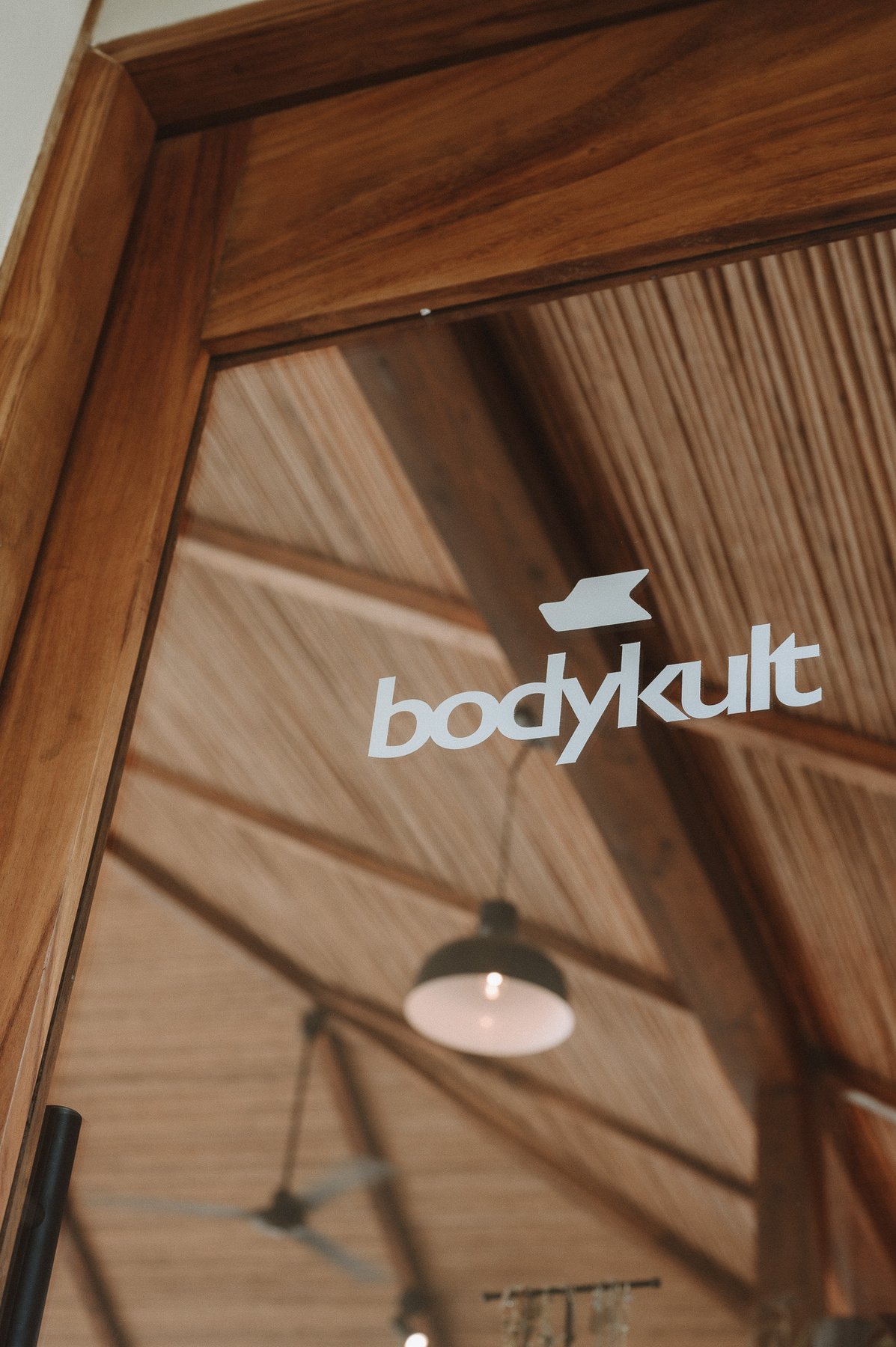 BodyKult logo etched into the studio's glass door